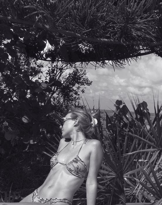 flora amazon model sitting at natural scene in the amazon rainforest in brazil.