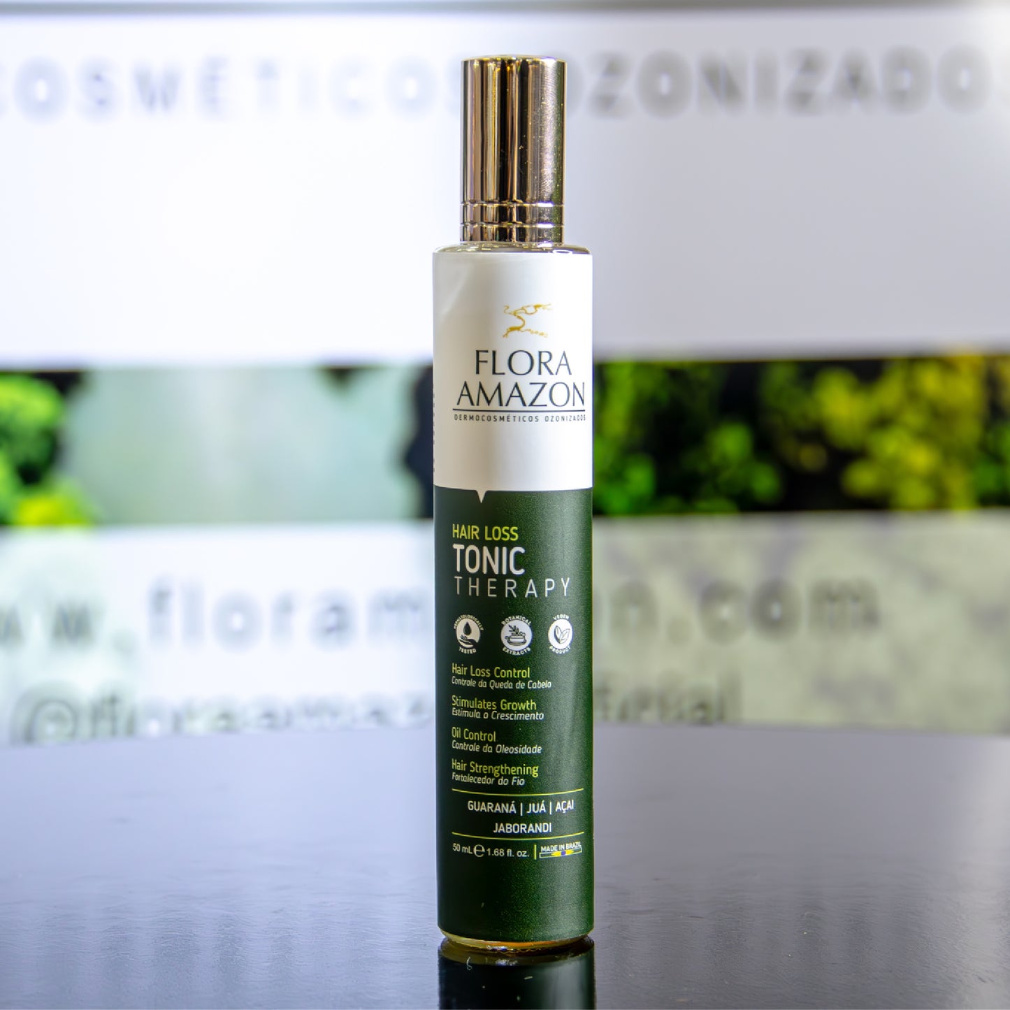 hair loss tonic by flora amazon on a table at a trade show.