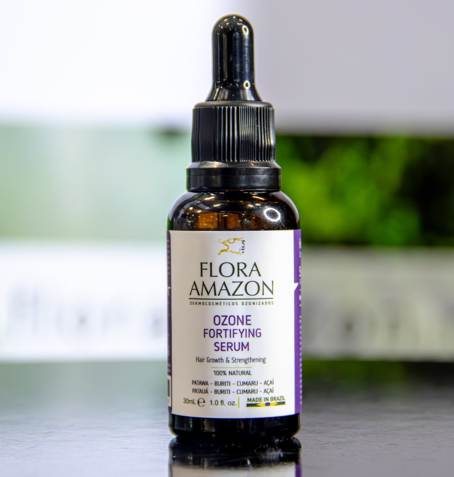 ozone fortifying serum by flora amazon on a table at a trade show.