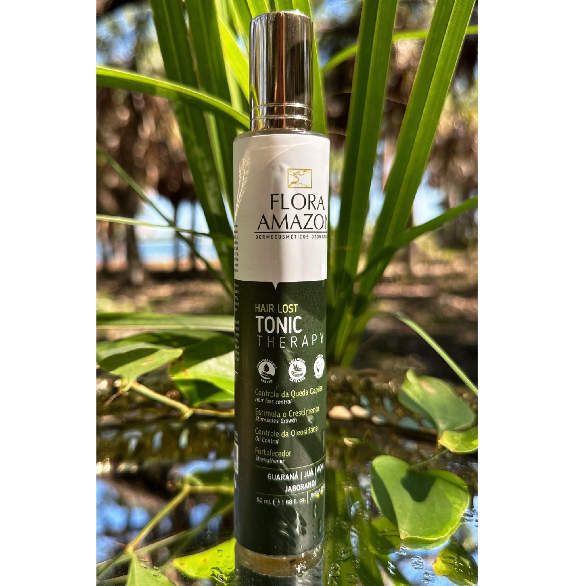 hair loss tonic bottle in the amazon rainforest, surrounded by a natural setting with leaves.