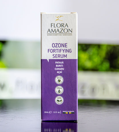 ozone fortifying serum package sitting on a table at a trade show.