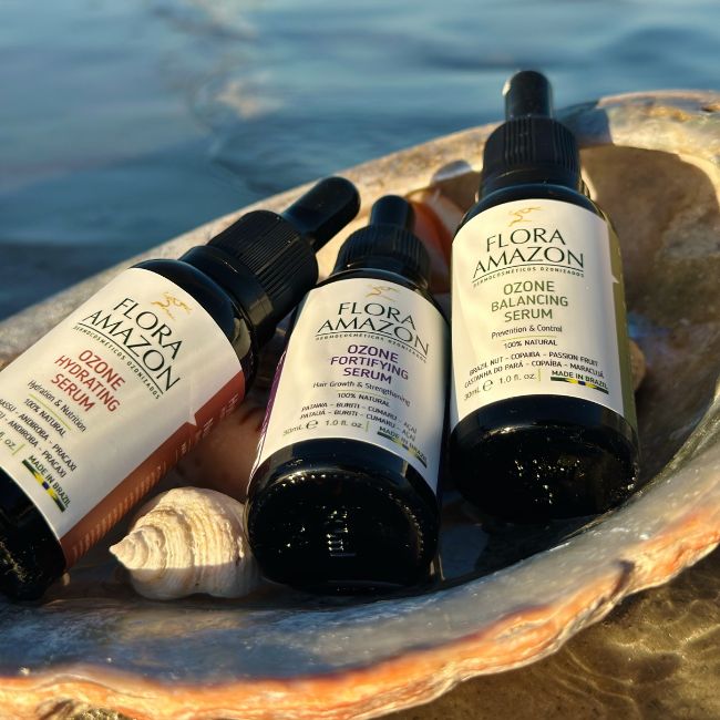 ozone hydrating, fortifying, and balancing serums for hair and skin in a shell with an ocean view. 