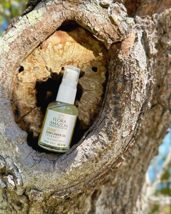 ozone sunflower oil sitting on a tree, a flora amazon secret for hair and skin health. 